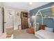 Nicely decorated bedroom with blue walls, a modern bed frame, wood accents and colorful decorations at 11031 Marshall St, Westminster, CO 80020
