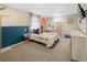 Bright bedroom with floral curtains, stylish décor, and modern fixtures at 11031 Marshall St, Westminster, CO 80020