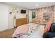 Well-decorated bedroom with a neutral color palette, a television, and ample storage at 11031 Marshall St, Westminster, CO 80020