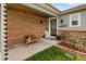 Inviting front porch with brick facade, bench, and address display creates curb appeal at 11031 Marshall St, Westminster, CO 80020