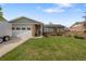 Well maintained home featuring a lush lawn and mature trees, complemented by brick accents at 11031 Marshall St, Westminster, CO 80020