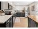 Updated kitchen featuring white cabinets, stainless steel appliances and butcher block countertop at 11031 Marshall St, Westminster, CO 80020