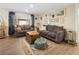 Comfortable living room with cozy seating, wood floors and a large window at 11031 Marshall St, Westminster, CO 80020