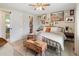Comfortable main bedroom with walk-in closet, ceiling fan, and rustic decor throughout at 11031 Marshall St, Westminster, CO 80020