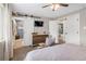 Inviting main bedroom with a large closet, decorative wood furnishings, and a tv mounted above the dresser at 11031 Marshall St, Westminster, CO 80020