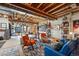 Spacious basement with wooden beams and creative decor, a perfect place for art or relaxation at 11744 Magnolia Dr, Thornton, CO 80233