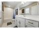 Bright bathroom features a double sink vanity, granite countertops, and a shower-tub combo at 11744 Magnolia Dr, Thornton, CO 80233
