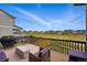 Outdoor deck area featuring a barbecue, seating, and views of the community at 11744 Magnolia Dr, Thornton, CO 80233