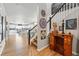 Inviting entryway with hardwood floors and adjacent living area, showcasing the home's open floor plan at 11744 Magnolia Dr, Thornton, CO 80233