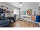 The office features a comfortable chair, functional desk, and stylish decorations to improve productivity at 11744 Magnolia Dr, Thornton, CO 80233