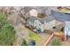 An aerial view shows the deck, fenced-in yard, landscaping, and roof of this home at 15865 E Kepner Dr, Aurora, CO 80017