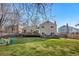 Spacious backyard with a large deck, outdoor seating, and a lush lawn, perfect for outdoor activities and entertaining at 15865 E Kepner Dr, Aurora, CO 80017