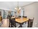 Bright dining area with a chandelier and natural light is perfect for Gathering meals and entertaining guests at 15865 E Kepner Dr, Aurora, CO 80017