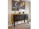 Elegant dining space featuring a stylish buffet with artistic decor is perfect for sophisticated entertaining at 15865 E Kepner Dr, Aurora, CO 80017