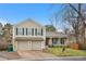 Charming two-story home featuring a two-car garage and a welcoming front porch at 15865 E Kepner Dr, Aurora, CO 80017