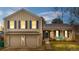 Charming two-story home featuring a two-car garage and a welcoming front porch at 15865 E Kepner Dr, Aurora, CO 80017
