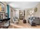 Spacious living room with hardwood floors, comfortable seating, and stylish decor offers a welcoming and versatile space at 15865 E Kepner Dr, Aurora, CO 80017