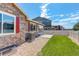 Landscaped backyard featuring a concrete patio and a well-maintained lawn, perfect for outdoor entertaining at 11129 Paradise Ln, Firestone, CO 80504