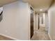 Basement hallway with carpet and an open bathroom door at 11129 Paradise Ln, Firestone, CO 80504