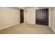 Bedroom with carpet, closet, and a view of another room at 11129 Paradise Ln, Firestone, CO 80504
