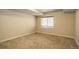 Carpeted bedroom with a window, closet, and dark trim at 11129 Paradise Ln, Firestone, CO 80504