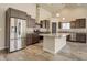 Modern kitchen featuring stainless steel appliances, granite countertops, and stylish wood cabinetry at 11129 Paradise Ln, Firestone, CO 80504