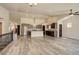 Open-concept area flows from living room to kitchen with cathedral ceiling creating lots of open space at 11129 Paradise Ln, Firestone, CO 80504