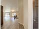 Open-concept living space with wood floors, natural light, and seamless transition to the kitchen at 11129 Paradise Ln, Firestone, CO 80504