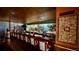 Relaxing bar area with bar stools, liquor shelves, and artwork at 13626 E Bates Ave # 302, Aurora, CO 80014