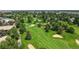 Scenic view of a lush golf course with mature trees and well-maintained greens in a desirable community at 13626 E Bates Ave # 302, Aurora, CO 80014