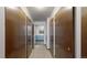 Apartment hallway with dark doors and numbered signs for clear navigation at 13626 E Bates Ave # 302, Aurora, CO 80014