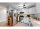 Modern kitchen features stainless steel appliances, granite counters, and white cabinets at 13626 E Bates Ave # 302, Aurora, CO 80014