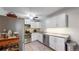 Modern kitchen featuring stainless steel appliances, granite counters, and white cabinets at 13626 E Bates Ave # 302, Aurora, CO 80014