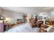 Open concept living space featuring wood floors, neutral walls, and plenty of natural light at 13626 E Bates Ave # 302, Aurora, CO 80014