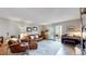 Comfortable living area with sliding door access to a sunroom offering natural light at 13626 E Bates Ave # 302, Aurora, CO 80014