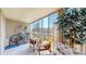 Relaxing enclosed patio offering a seating area, natural light, and room for bicycle storage at 13626 E Bates Ave # 302, Aurora, CO 80014