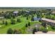A scenic golf course community with lush fairways, mature trees, and multiple serene ponds at 13626 E Bates Ave # 302, Aurora, CO 80014
