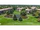Lush green golf course community featuring mature trees, serene pond, and meticulously maintained lawns at 13626 E Bates Ave # 302, Aurora, CO 80014