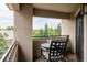 Exterior balcony area with seating that overlooks the trees in the community at 5301 S Birch Ct, Greenwood Village, CO 80121