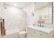 Bathroom with a tub and shower, a vanity with marble countertops, and colorful accents at 5301 S Birch Ct, Greenwood Village, CO 80121