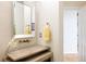 Stylish bathroom with a modern sink, unique fixtures, and a neutral color palette at 5301 S Birch Ct, Greenwood Village, CO 80121