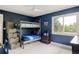 Bedroom with blue painted walls, a ceiling fan, and a bunk bed at 5301 S Birch Ct, Greenwood Village, CO 80121