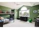 Bright bedroom featuring a high ceiling, a large window, and a playful bunk bed at 5301 S Birch Ct, Greenwood Village, CO 80121