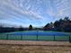 Outdoor tennis court facility on a partially cloudy day at 5301 S Birch Ct, Greenwood Village, CO 80121