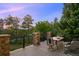 Enjoy outdoor dining on this home's back deck overlooking lush scenery at 12147 S Shady Pine Ct, Parker, CO 80134