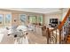Finished basement offering a game table, a spacious seating area and large windows that bring in natural light at 12147 S Shady Pine Ct, Parker, CO 80134
