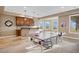 Basement offering a game table, a bar with hanging lights, and large windows that bring in lots of light at 12147 S Shady Pine Ct, Parker, CO 80134
