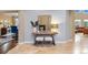 Sun-filled foyer boasts gorgeous floors, neutral walls, and flows into other living spaces at 12147 S Shady Pine Ct, Parker, CO 80134