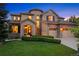 Charming two-story home boasting a well-manicured lawn, stone accents and a three-car garage at 12147 S Shady Pine Ct, Parker, CO 80134