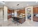 Spacious kitchen features a large island with seating, granite countertops, and stainless steel appliances at 12147 S Shady Pine Ct, Parker, CO 80134